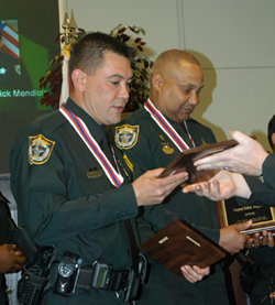 Corporal Belden Ferguson and CO Frederick Mendiola accepting award