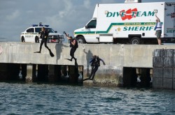 Dive Training. 3 divers jumping in water