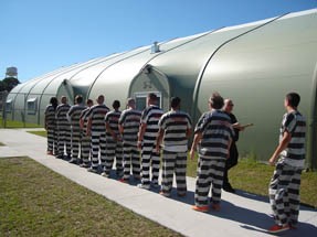 Inmates transfer from Jail Annex to tents 2 & 3. These tents increase the inmate population capacity from 1041 to 1341.